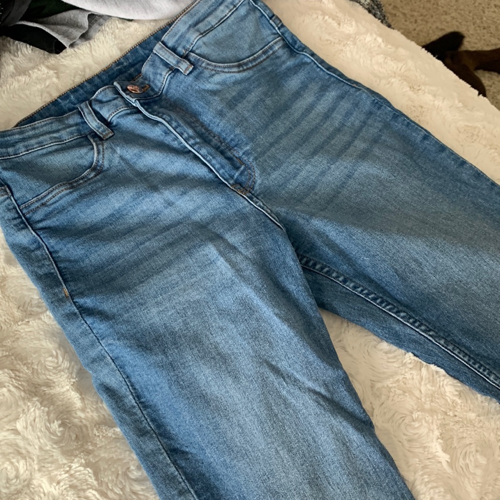 divided skinny blue jeans